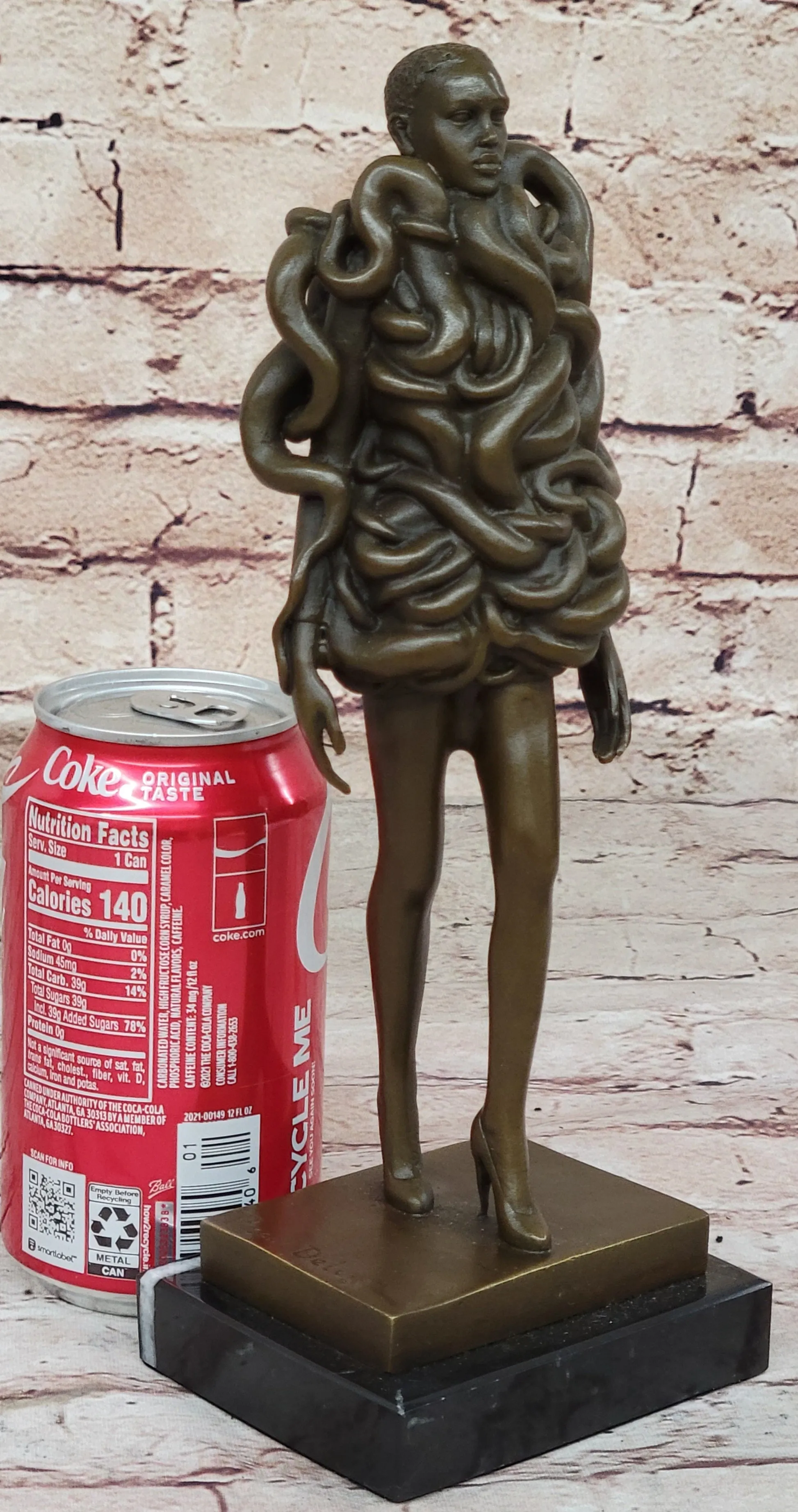 Contemporary Art Bronze Sculpture of Woman Wearing Snakes - Unwavering by Pascal Delor