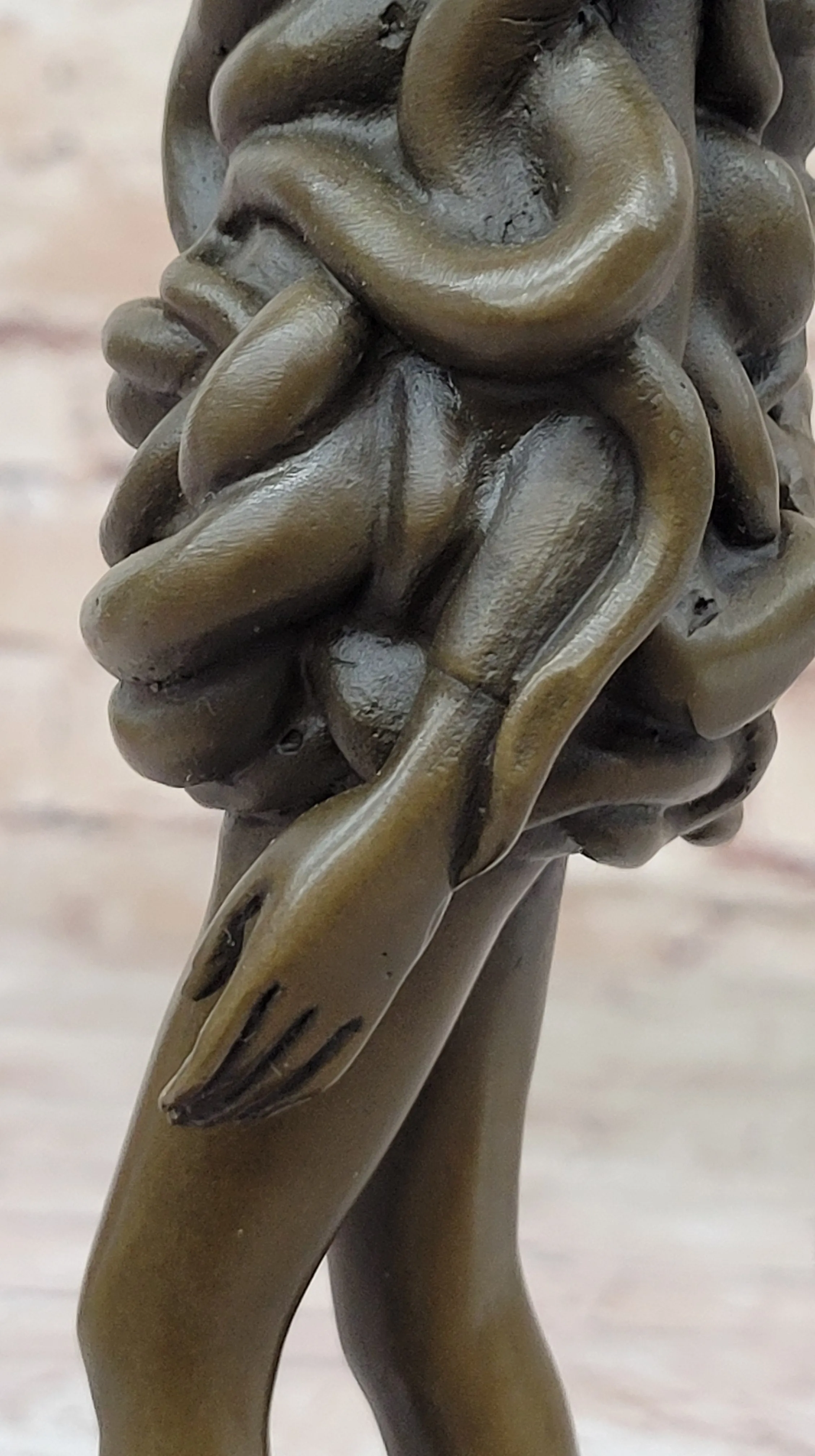 Contemporary Art Bronze Sculpture of Woman Wearing Snakes - Unwavering by Pascal Delor
