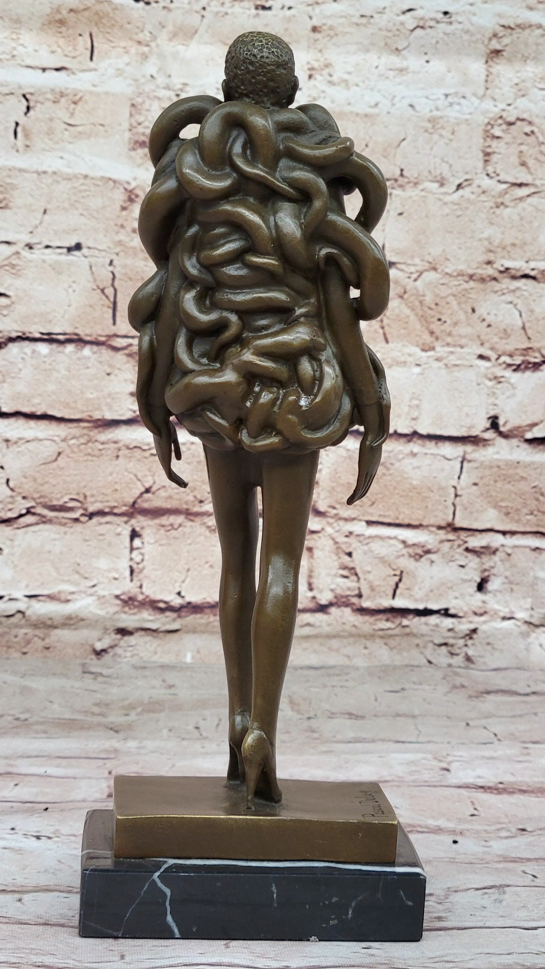 Contemporary Art Bronze Sculpture of Woman Wearing Snakes - Unwavering by Pascal Delor