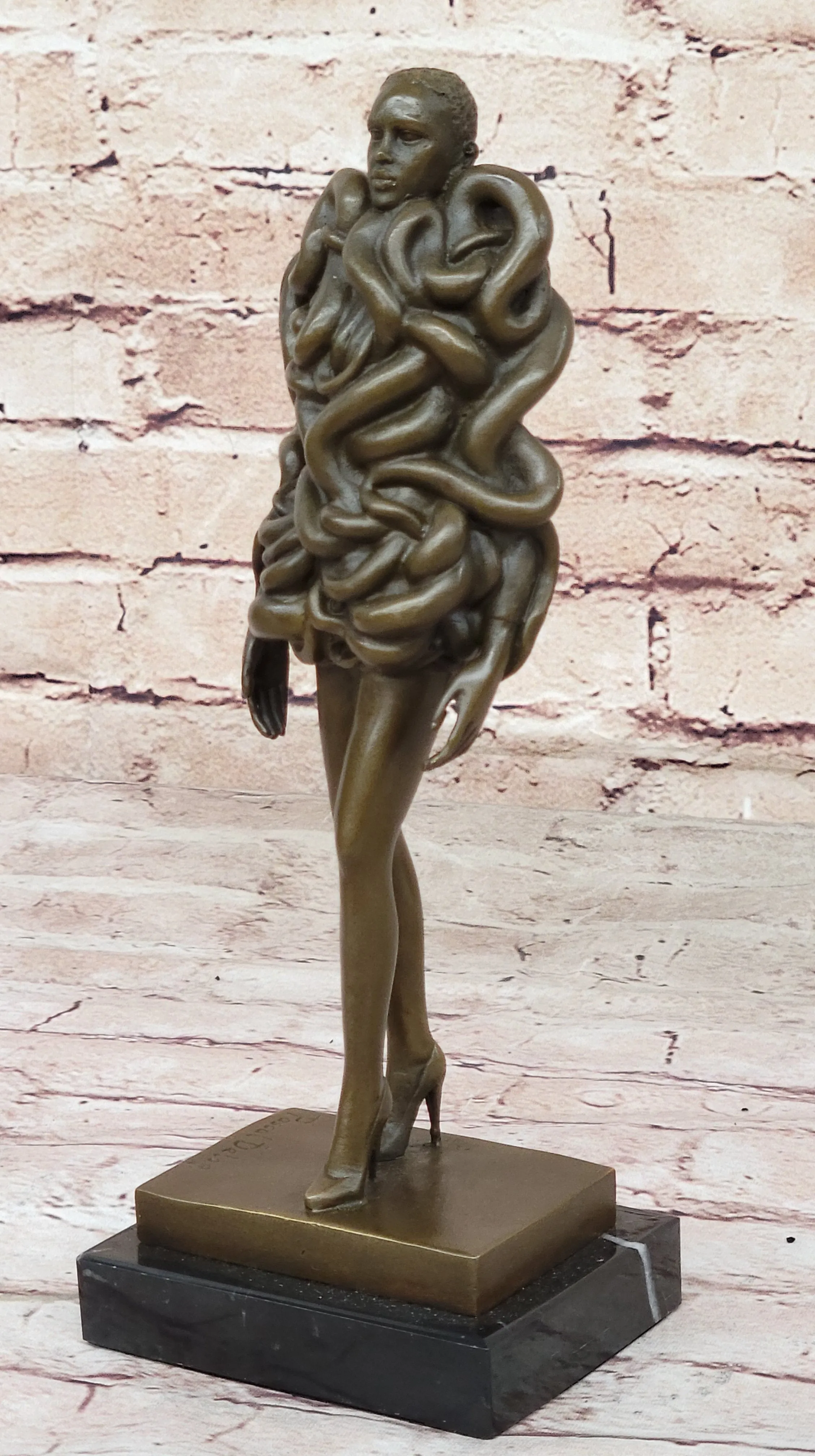 Contemporary Art Bronze Sculpture of Woman Wearing Snakes - Unwavering by Pascal Delor