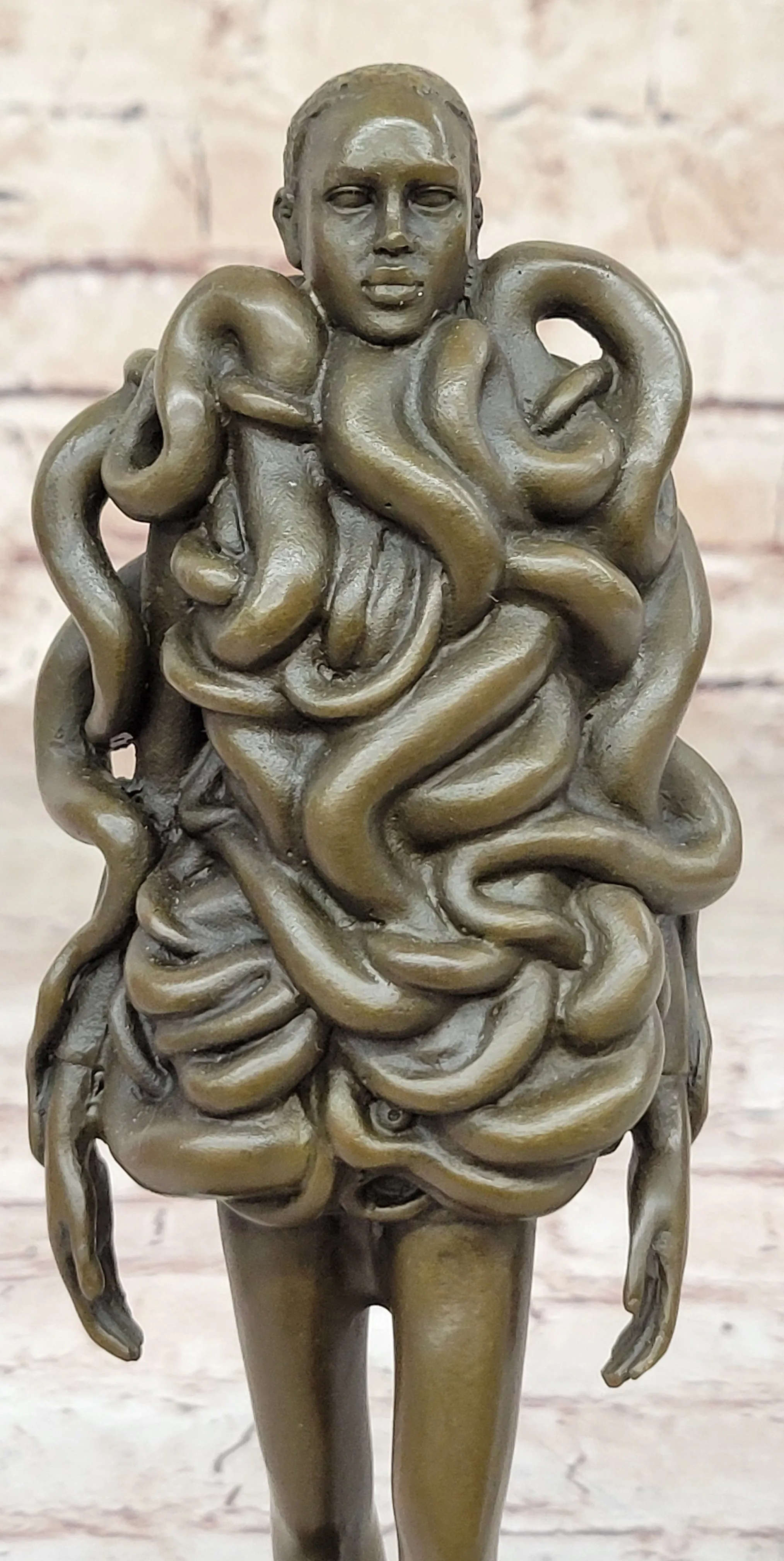Contemporary Art Bronze Sculpture of Woman Wearing Snakes - Unwavering by Pascal Delor