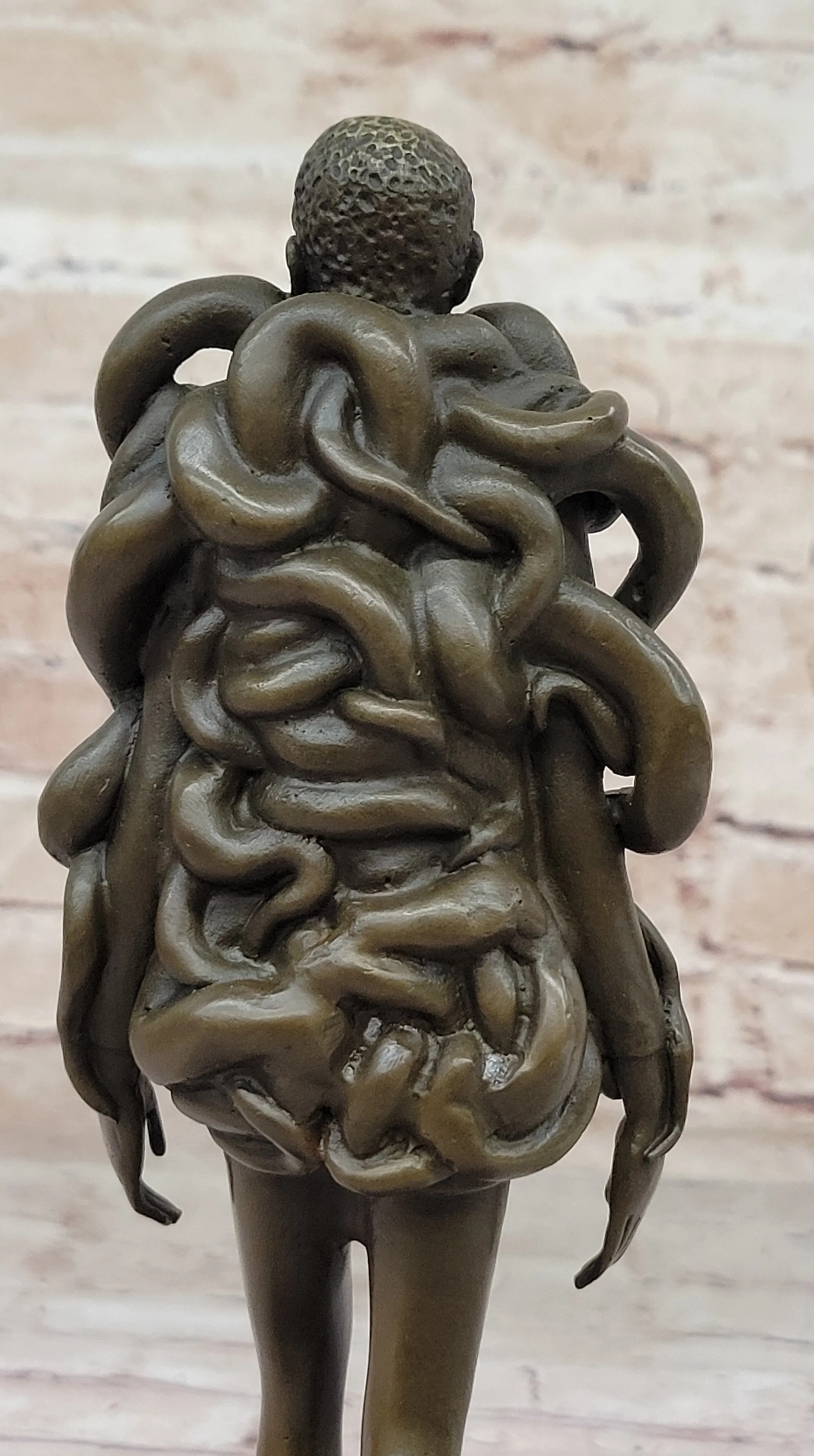 Contemporary Art Bronze Sculpture of Woman Wearing Snakes - Unwavering by Pascal Delor